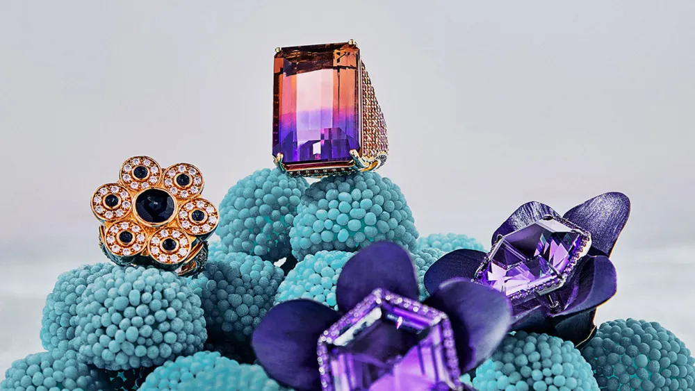 Colored stone pieces laid out for buyer appointments at Couture in Las Vegas, the show where much of this season's award-carpet inventory was first written up.