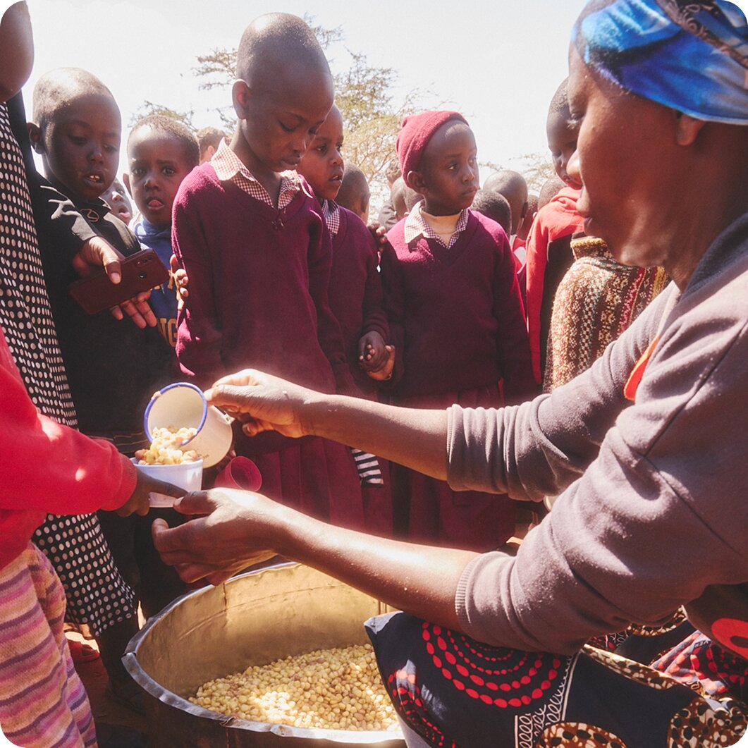 Children receiving meals through a Brilliant Earth-supported community program