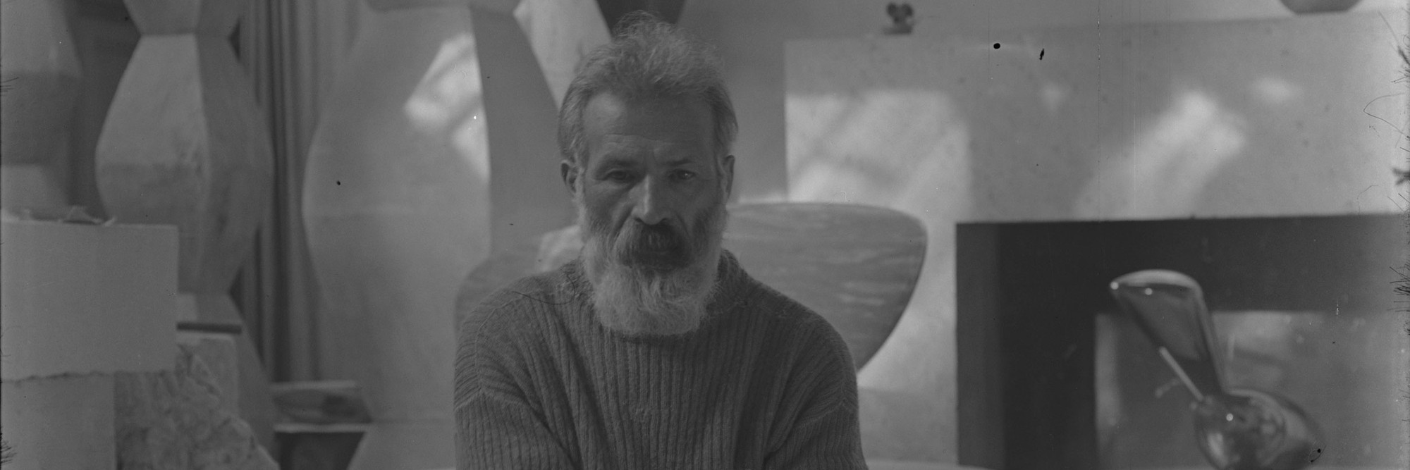 Constantin Brancusi, self-portrait in the studio with Endless Columns I–IV, Fish (1930), and Leda (1926), impasse Ronsin, Paris.