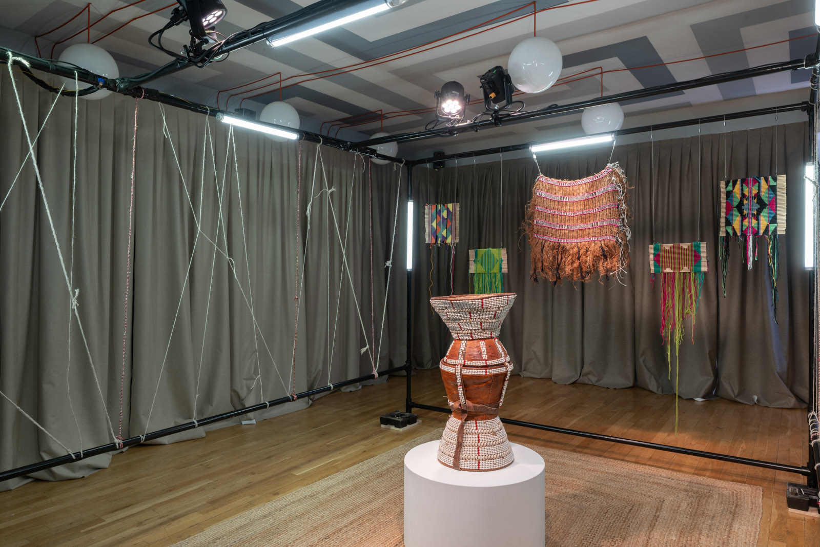 Fozia Ismail Knots a Living Archive — Fozia Ismail portrait with her xeedho weavings