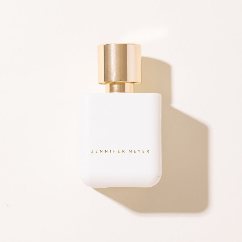 Jennifer Meyer Eau de Parfum, presented as a matte glass bottle with a gold lid