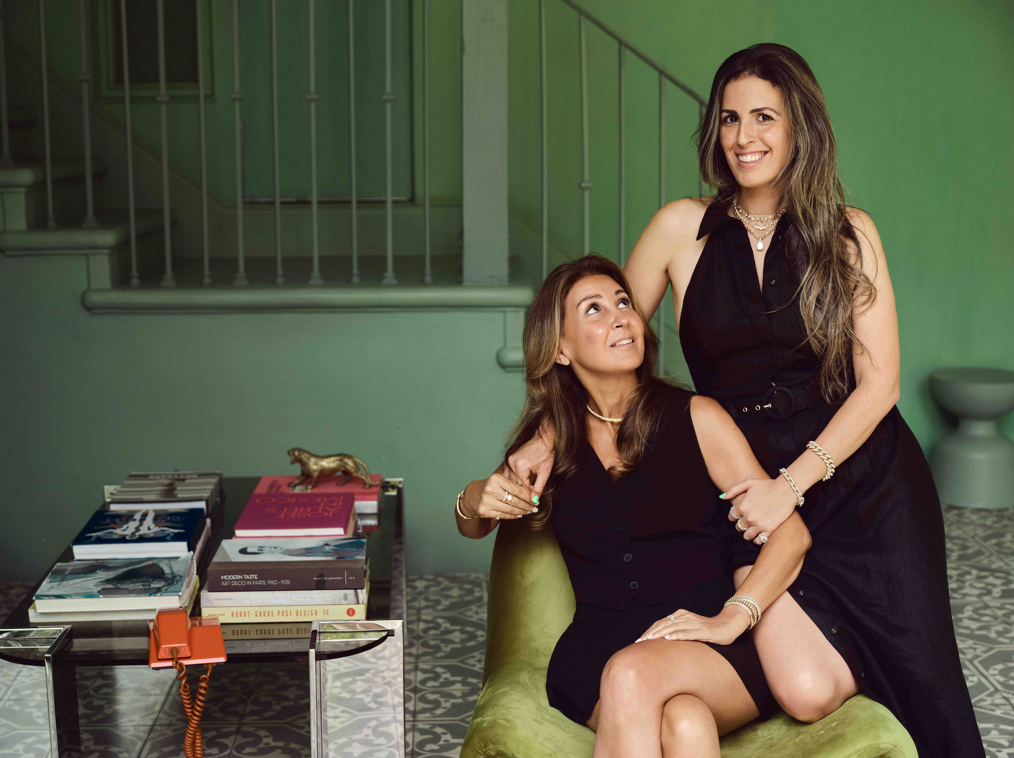 Ladan Vahdat and Tania Shayan in an interior filled with collected references