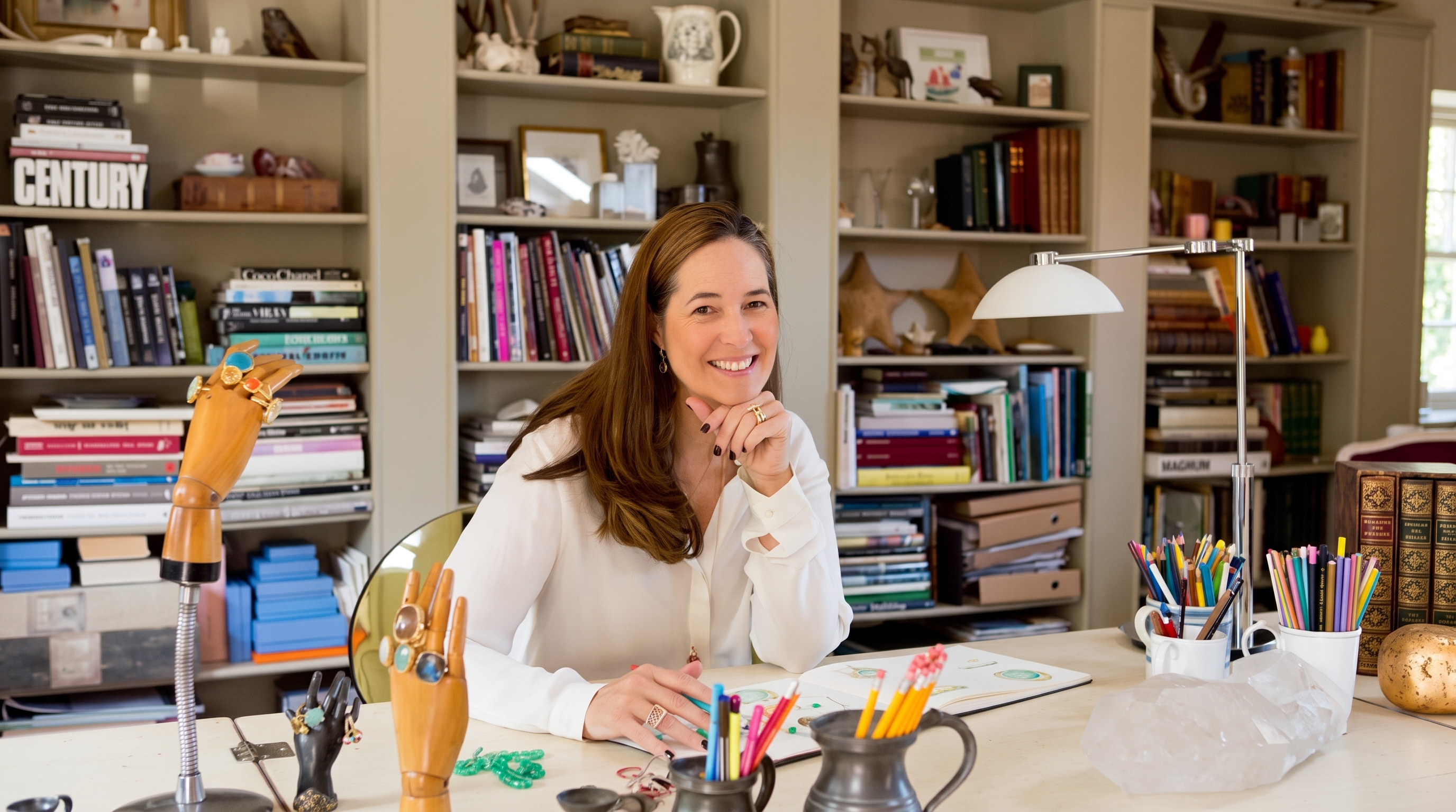 Monica Vinader at work in her Marylebone studio, surrounded by sketches, stones and jewellery in progress.